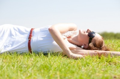 woman lying in field